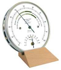 Wohnklima Hygrometer-Thermometer in stainless steel casing with wall mount.