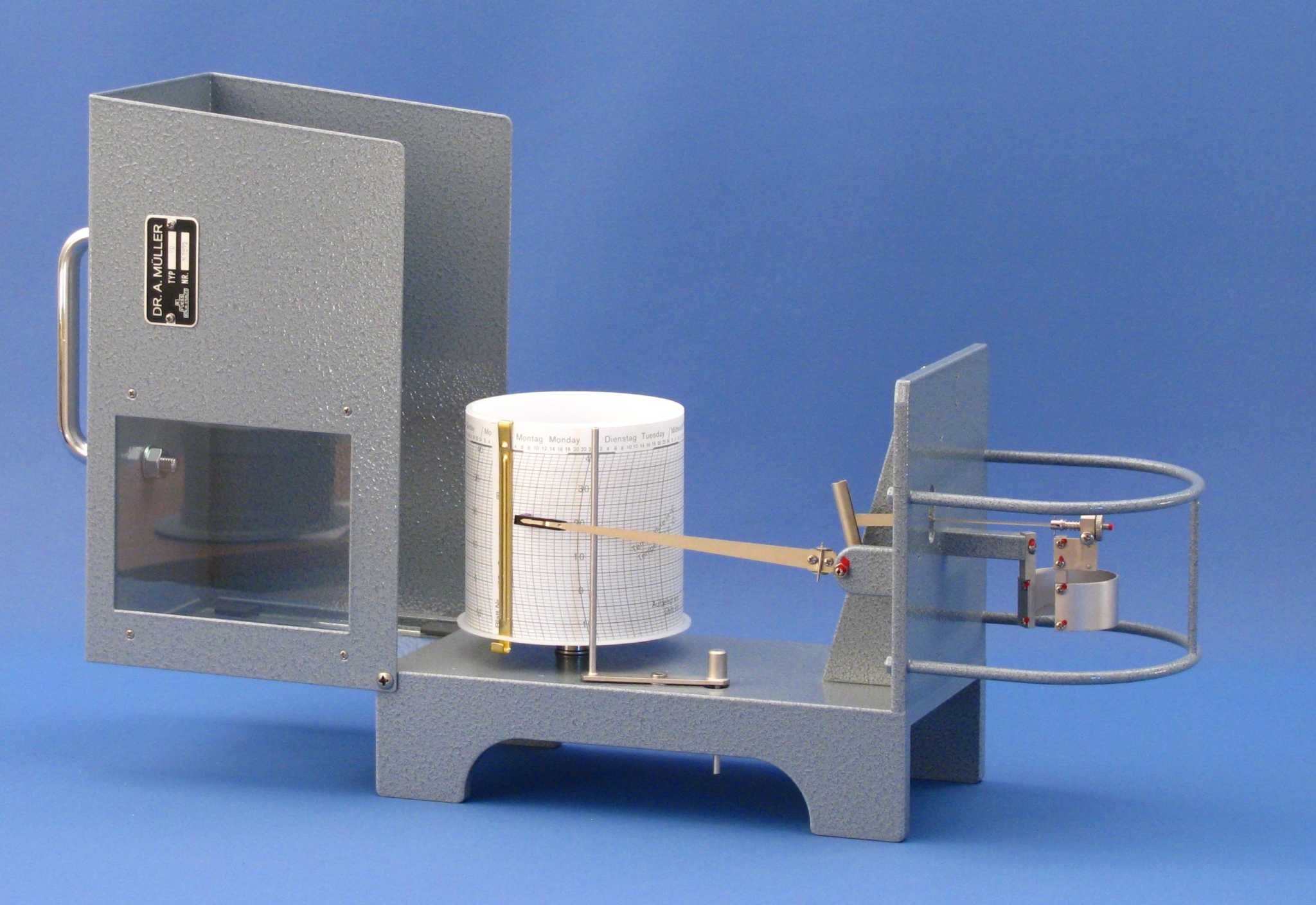 Thermograph for continuous temperature recording with a rotating paper drum and writing arm.