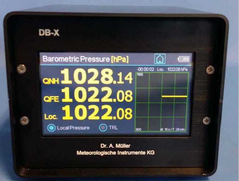 Digital barometer DB-X with touch display showing barometric pressure readings in hPa for aviation and meteorological use.
